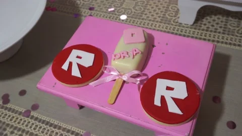 Some peculiar round and ice cream-shaped cookies on a pink tray. Stock Footage 155267367
