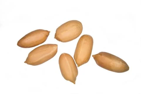 Some peeled peanuts on a white background Stock Photos