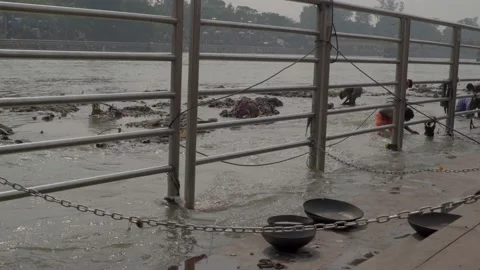 Some people are finding for gold and rupees coins in the river, which were do Video stock 221890200