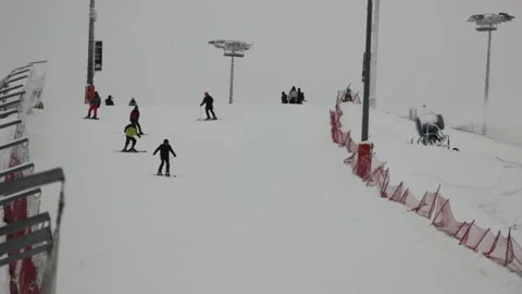 Some people are skiing down the pass at the ski resort Stock Footage 146638512
