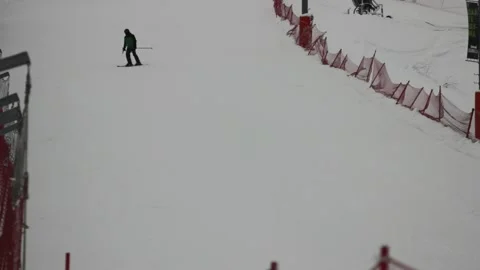 Some people are skiing down the pass at the ski resort Stock Footage 146638559