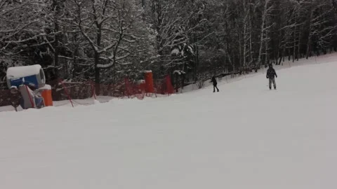 Some people are skiing down the pass at the ski resort Stock Footage 146638613