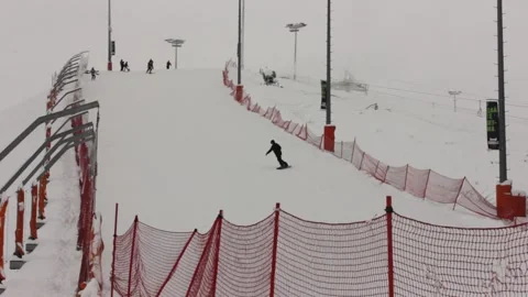 Some people are skiing down the pass at the ski resort Stock Footage 146638631
