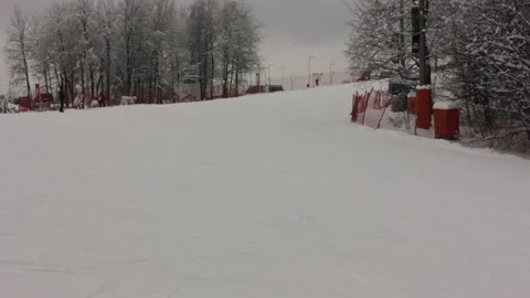 Some people are skiing down the pass at the ski resort Stock Footage 146638701