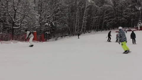 Some people are skiing down the pass at the ski resort Stock Footage 146638715