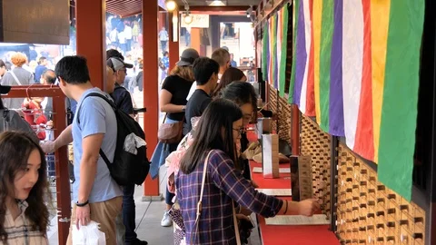 Some of the people inside the Senso-ji Temple in Tokyo Japan Stock Footage 121385929