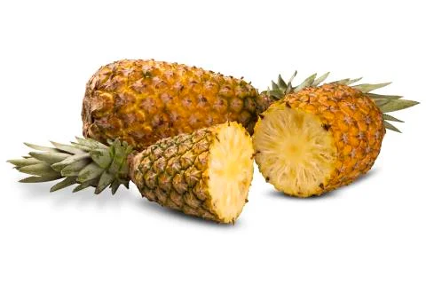 Some pineapples over a white background. Stock Photos