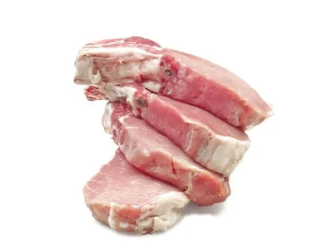 Some pork chops on a white background Stock Photos