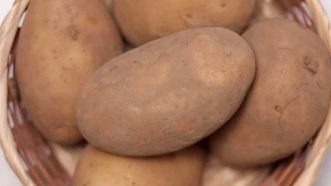 Some potatoes in a basket Stock Footage 127573604