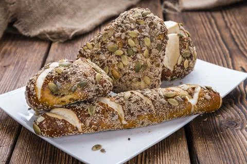 Some Pretzel Rolls with mixed Seeds (close-up shot) 写真素材