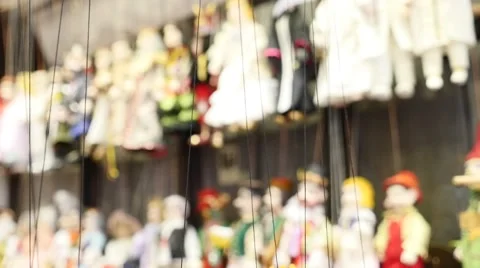 Some puppets in a window display Stock Footage 58606568