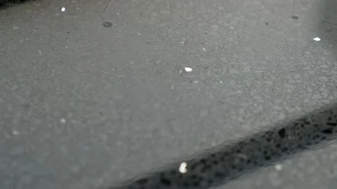 Some raindrops or waterdrops are dropping on to the platform slowly Stock Footage 132707923
