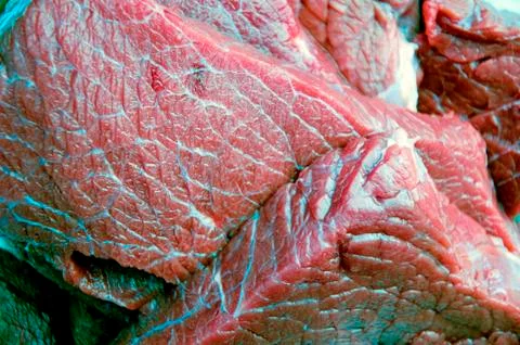 Some raw beef fillets on a plate. Close up macro. Selective focus. Stock Photos