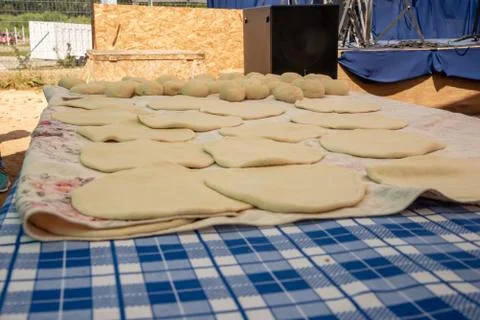 Some raw sopaipillas on a table Stock Photos