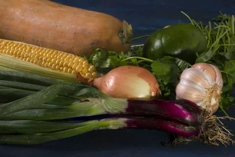 Some raw vegetables on a blue table. Foto stock