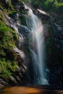 Some rays of sun cross the waters of the Toxa waterfall Stock Photos