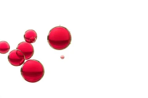 Some red air bubbles is isolated over a white background Stock Photos