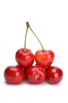Some red cherries with and without stalks isolated on the white background Stock Photos