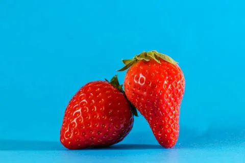 Some red strawberries in a macro view Stockfoto's