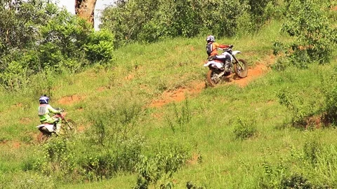 Some riders going up a big hill Stock Footage 89731016