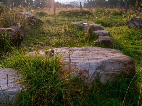 Some rocks illuminated by the light of sunset, captured at the highlands of t Stock Photos