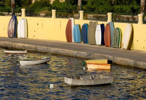 Some small boats in the harbor of Bugibba in Malta. Stock Photos