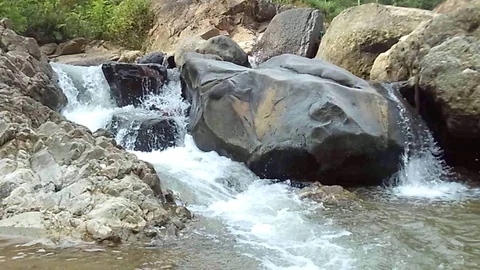 Some small waterfall stream on the big river on the mountain Video stock 125121138