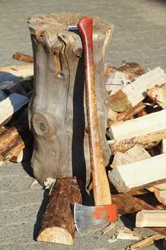 Some Split firewood with ax and block Stock Photos