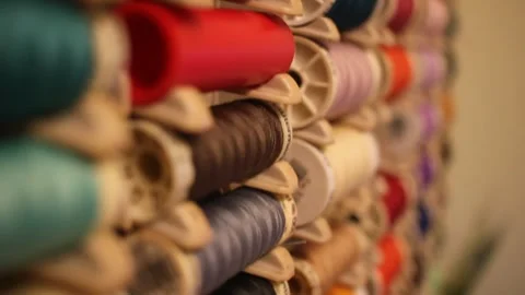 Some spools of thread on a cabinet Stock Footage 324682045
