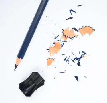 Some study materials containing a blue pencil and a black color plastic sharp Stock Photos