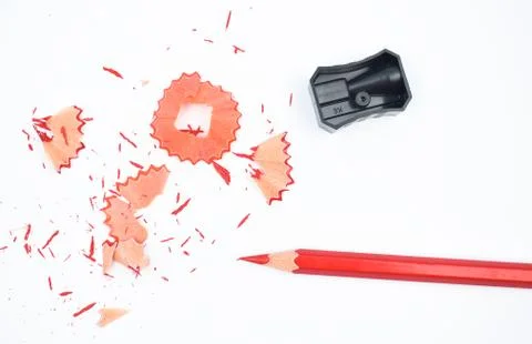 Some study materials containing a red pencil and a black color plastic sharpe Stock Photos
