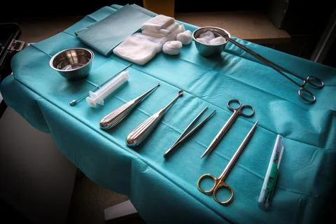Some surgical instruments for abscess splitting are lying on an operating tab Stock Photos