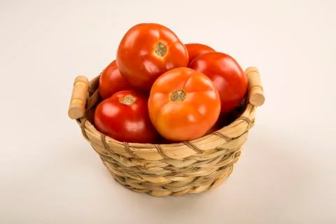Some tomatoes over a white background Stock Photos
