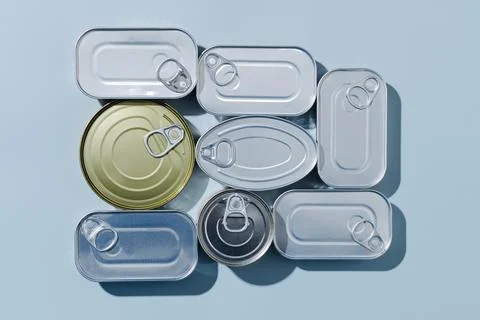 Some unopened tin cans of different canned food Stock Photos