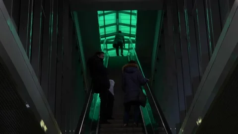 Some unrecognizable people going upwards on escalator Stock Footage 145364398