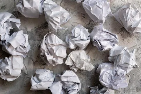 Some white paper balls on the table in office, mess in the minds Stock Photos