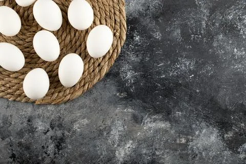 Some of white raw chicken eggs on a sackcloth Stock Photos