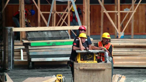 Some workers are resting while others work Stock Footage 132429334