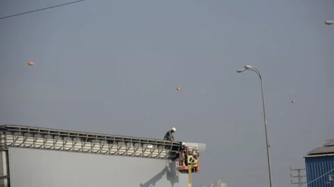 Some workers on siding works look from distance Видео 212526213