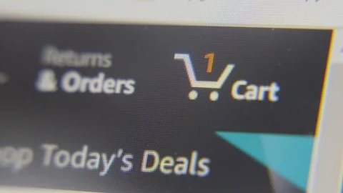 Somebody adding goods to a cart at internet shop. Online shopping Stock Footage 126047688