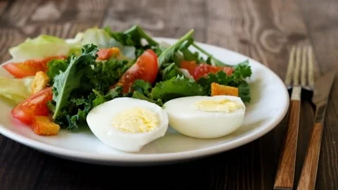 Somebody adding mayonese sauce to eggs Stock Footage 89836499