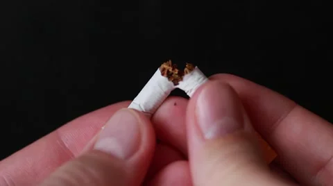 Somebody breaks a cigarette Stock Footage 65372228