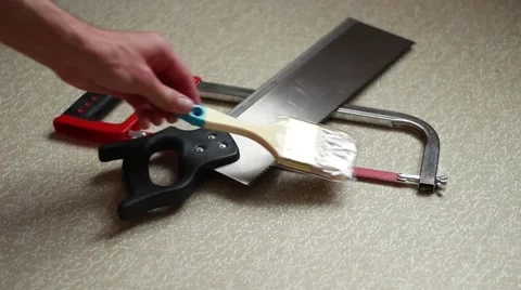 Somebody displays tools on a floor Stock Footage 64622777