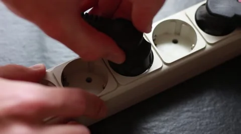 Somebody inserts cable into the socket 動画素材 64622307