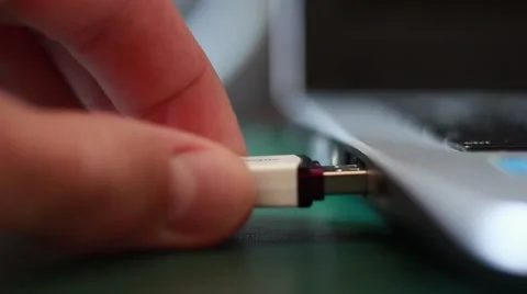 Somebody inserts a flash card into the computer Stock Footage 64622706