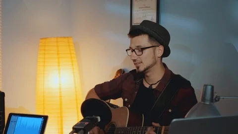 Somebody interrupting musician with a remark while he singing and playing guitar Video stock 116551302