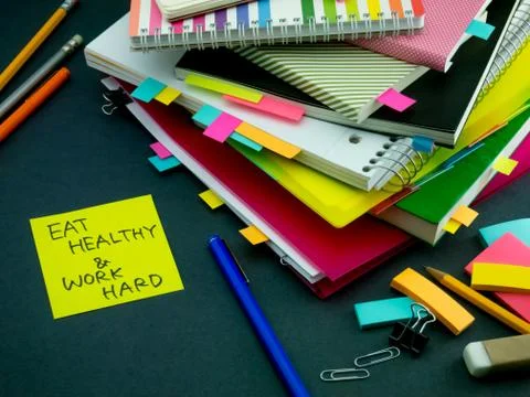 Somebody Left the Message on Your Working Desk; Eat Healthy and Work Hard Stock Photos
