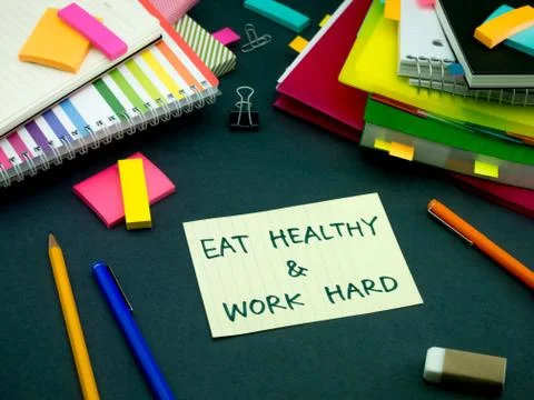Somebody Left the Message on Your Working Desk; Eat Healthy and Work Hard Stock Photos