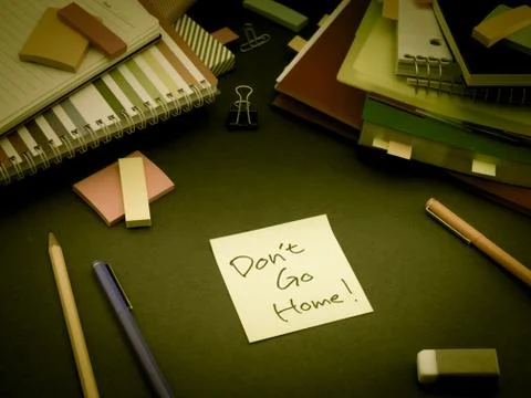 Somebody Left the Message on Your Working Desk; Don't Go Home Stock Photos