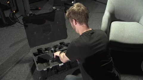 Somebody opens a flightcase with zeiss cine lenses Stock Footage 220339056